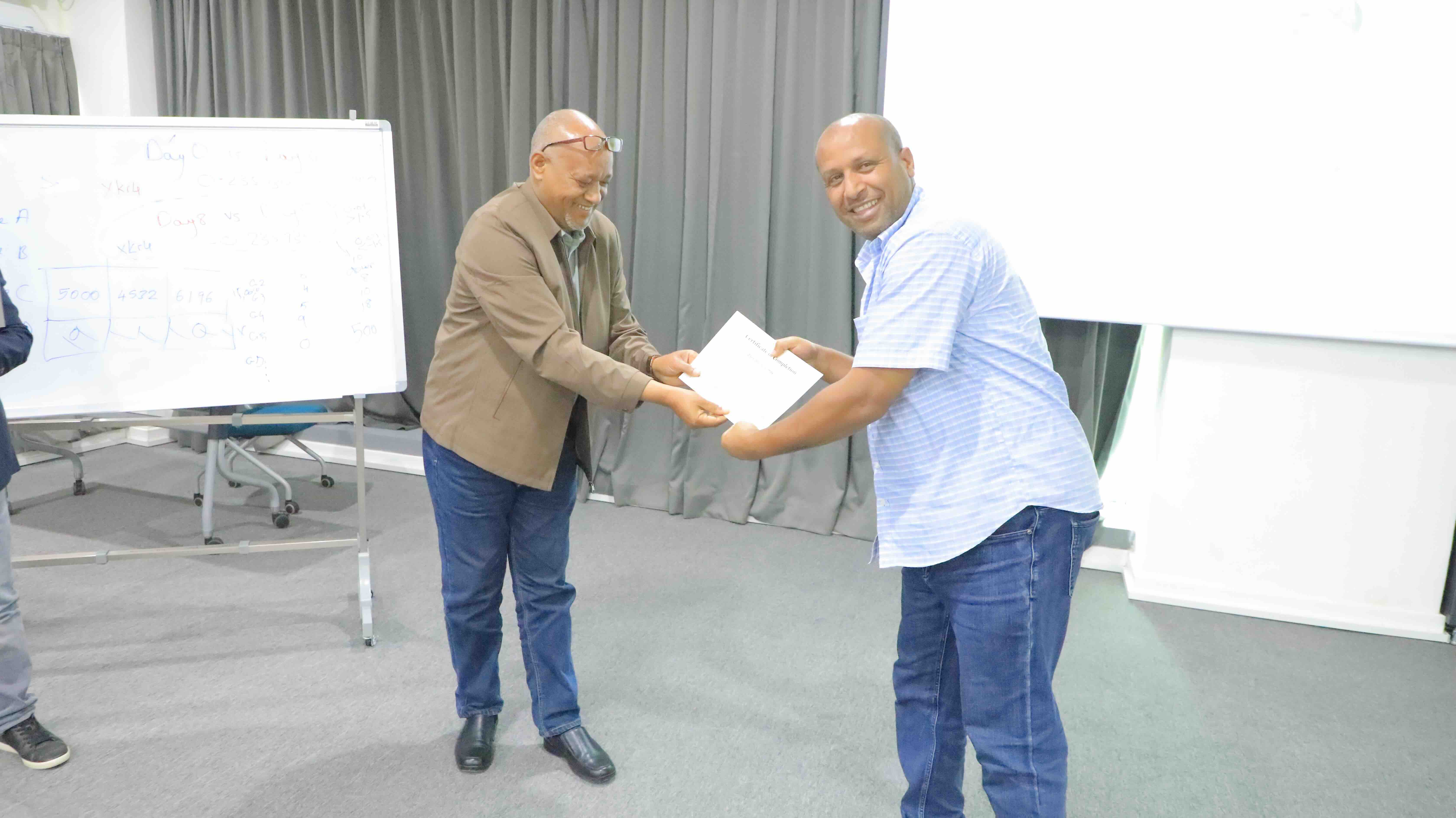 Participant receiving course certificate