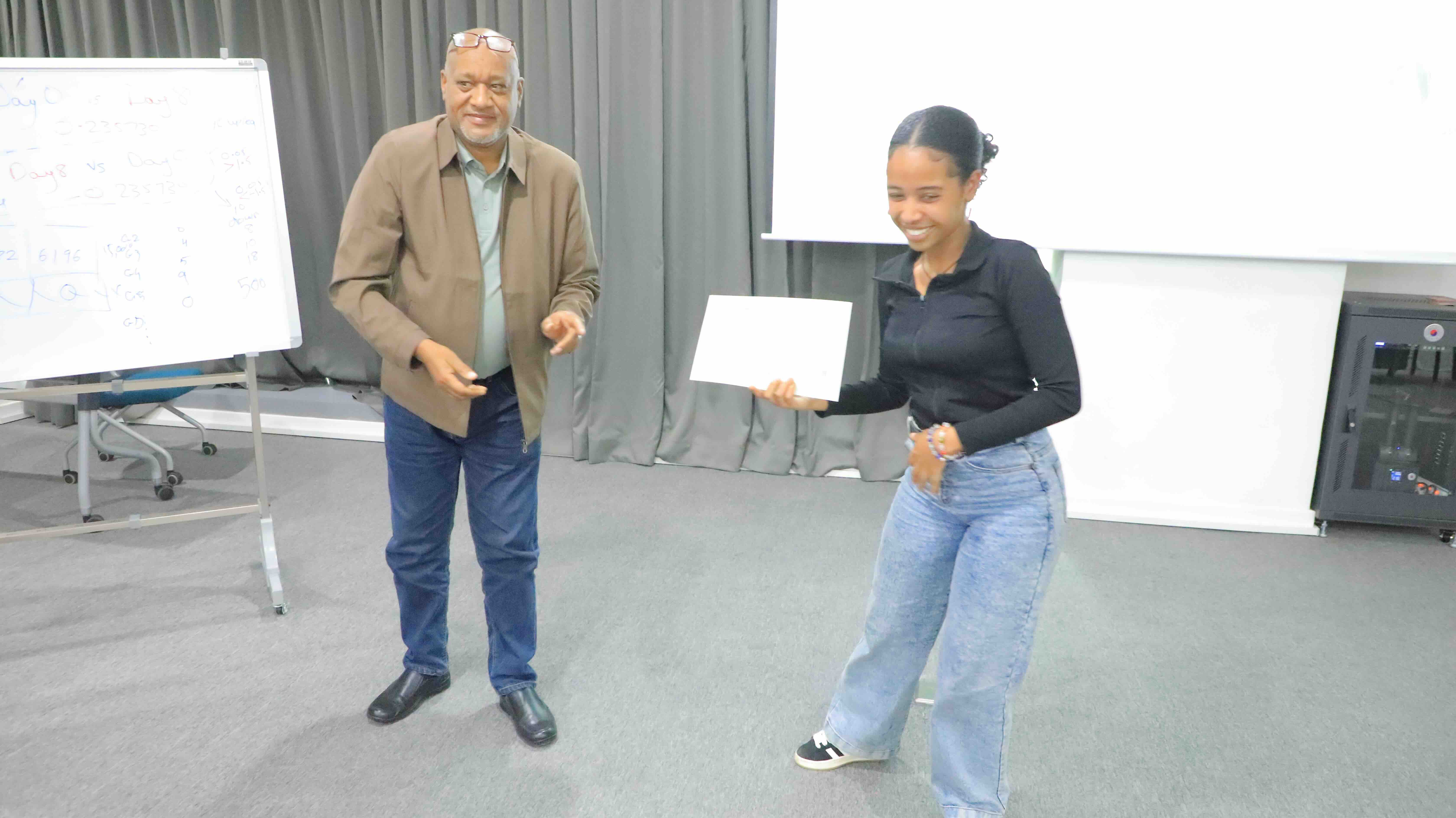Another participant receiving course certificate